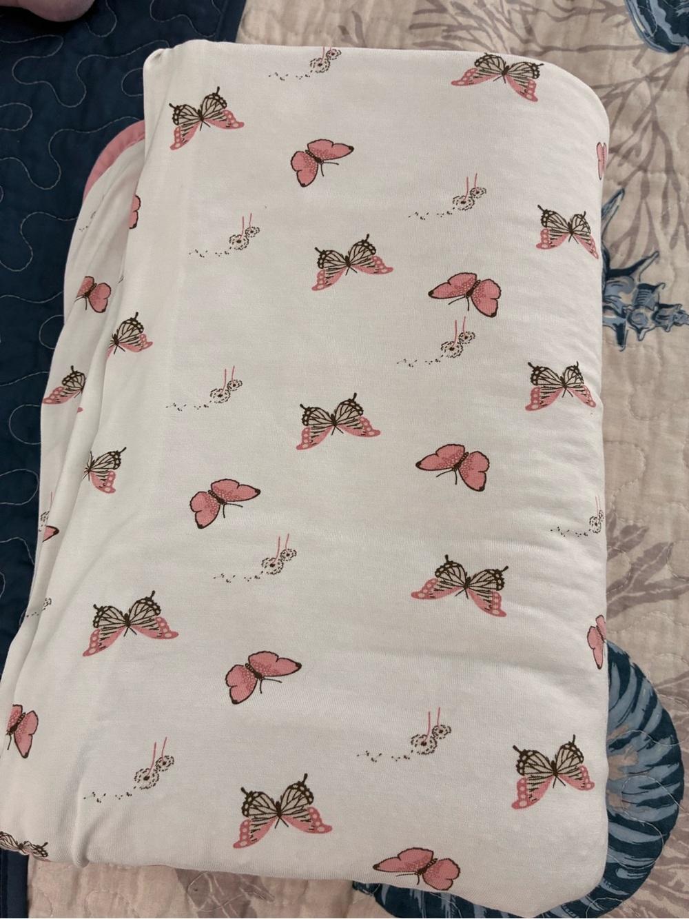 White Kyte baby toddler blanket 1.0 with Pink Butterfly Print.